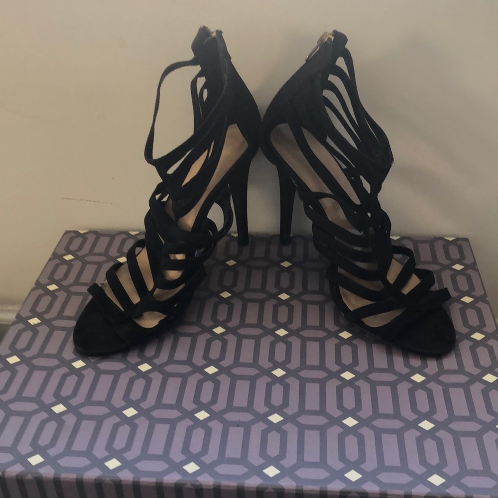 Arden B Black heels with gold zipper.